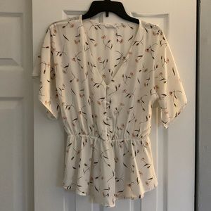 Sienna Sky Medium White Shirt with Floral Pattern.